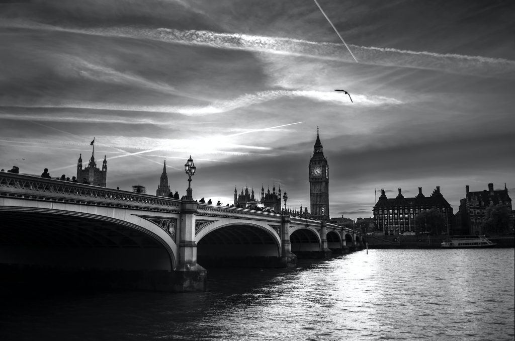 grayscale photo of bridge over river