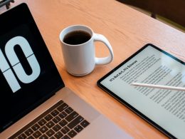 a tablet and a cup of coffee on a table