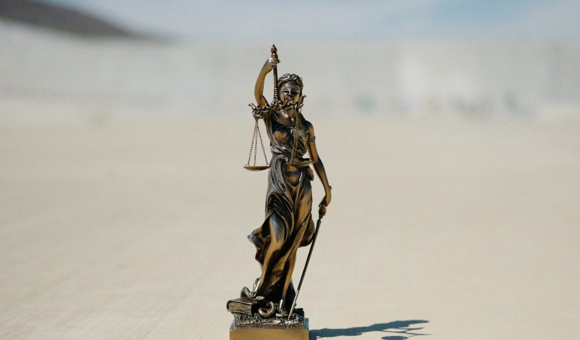 a statue of a lady justice holding a scale